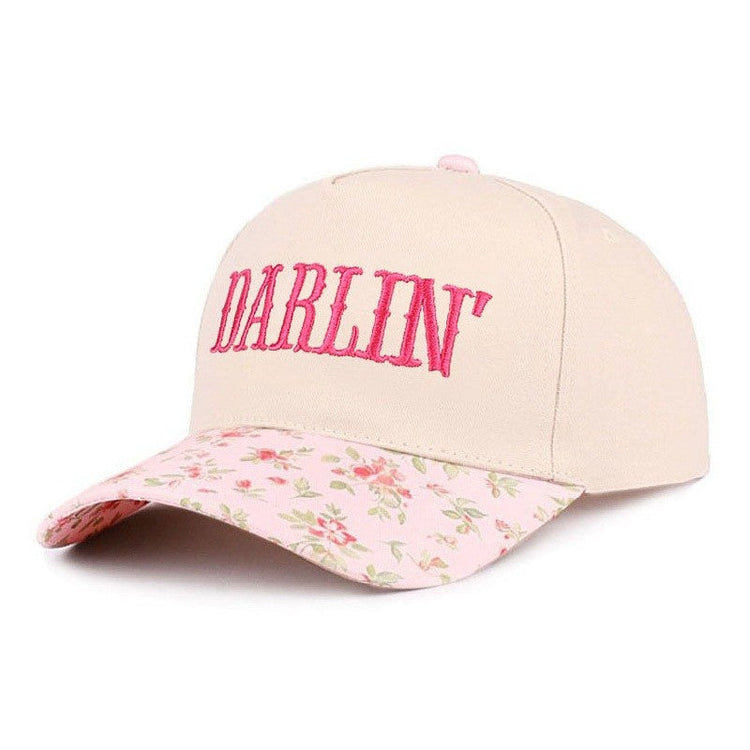 Beige cap with floral brim and 'Darlin' text in pink on a white background