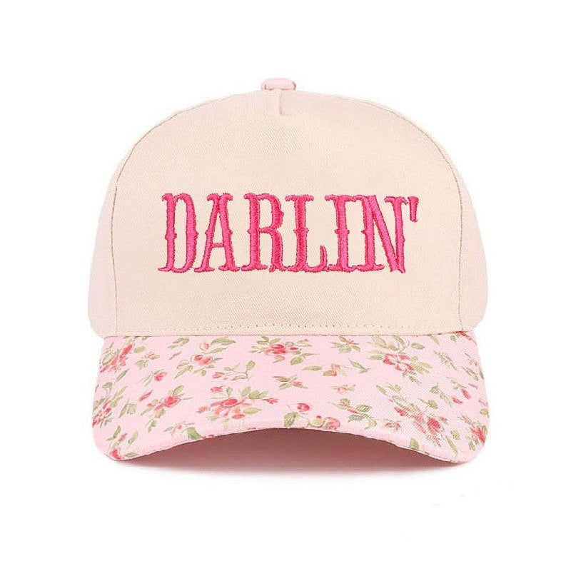 Cap with floral brim and 'Darlin' text on a white background