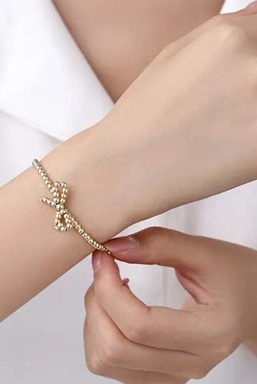 Gold bow bracelet, stainless steel, tarnish free